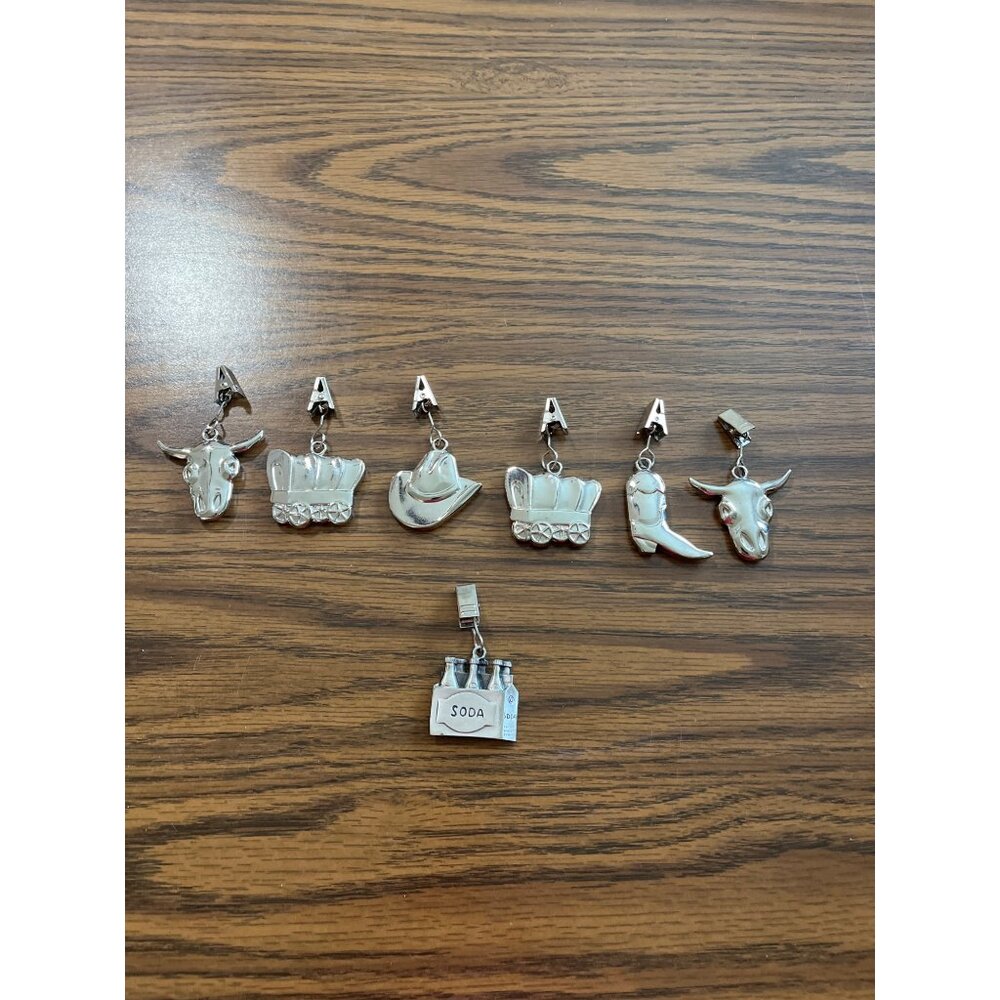 Silver tone tablecloth clips western and soda themed